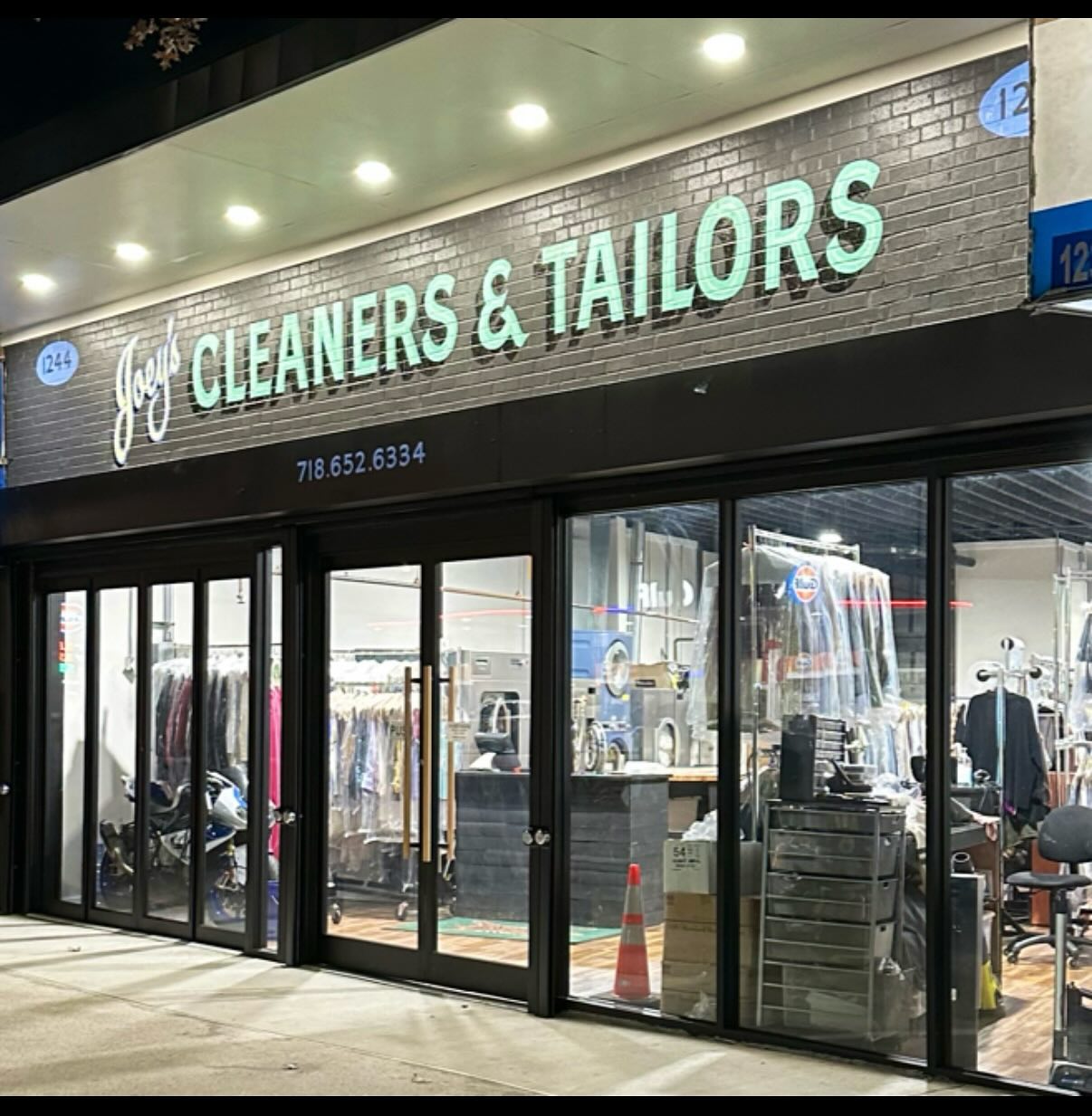 Finished retail storefront renovation with new signage, New York City